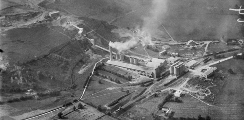 This image: a photograph of the Hope Cement Works taken in 1930, one year after the works 
							 began operations in 1929.
							 The map: the map shows aerial imagery of how the site looks today. There are interactive 
							 markers with photographs of the site taken in 1930, 1952, 1972 and 1995, showing the 
							 dramatic change in landscape over the years, with the growth of the limestone quarry, 
							 as well as the growth of woodland around the site.